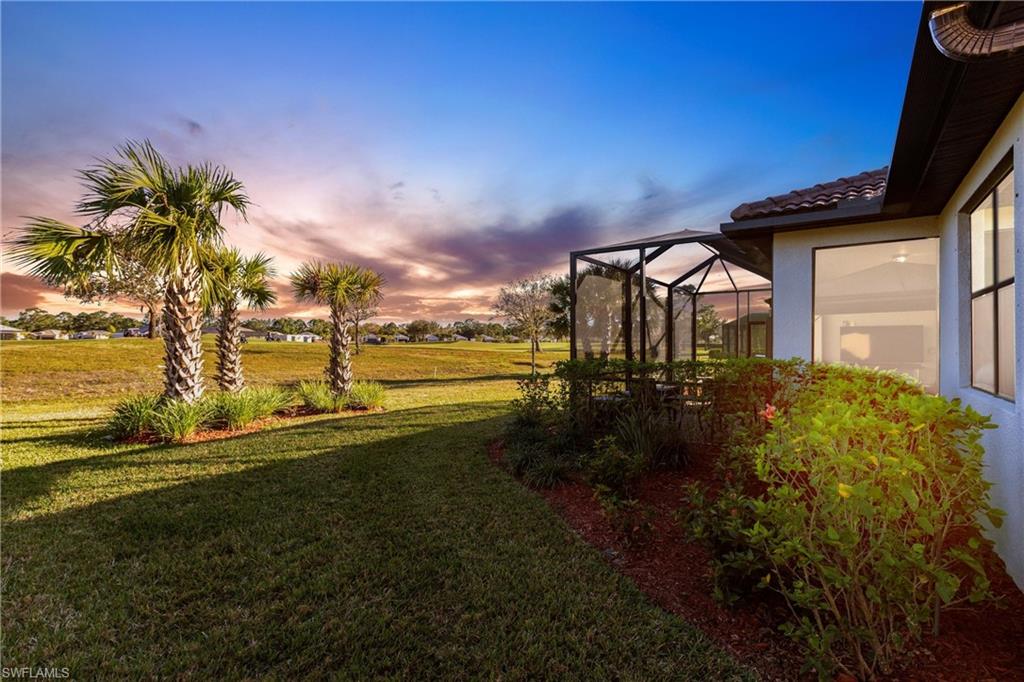 3032 Walnut Grove Lane Alva, FL 33920 - Photo 34 of 49 a front view of a house with a yard