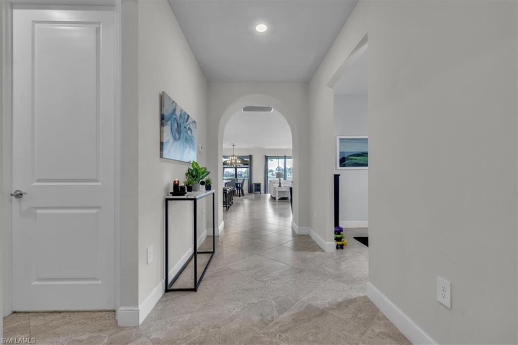 3032 Walnut Grove Lane Alva, FL 33920 - Photo 6 of 49 wooden floor in a hall with a window and wooden floor
