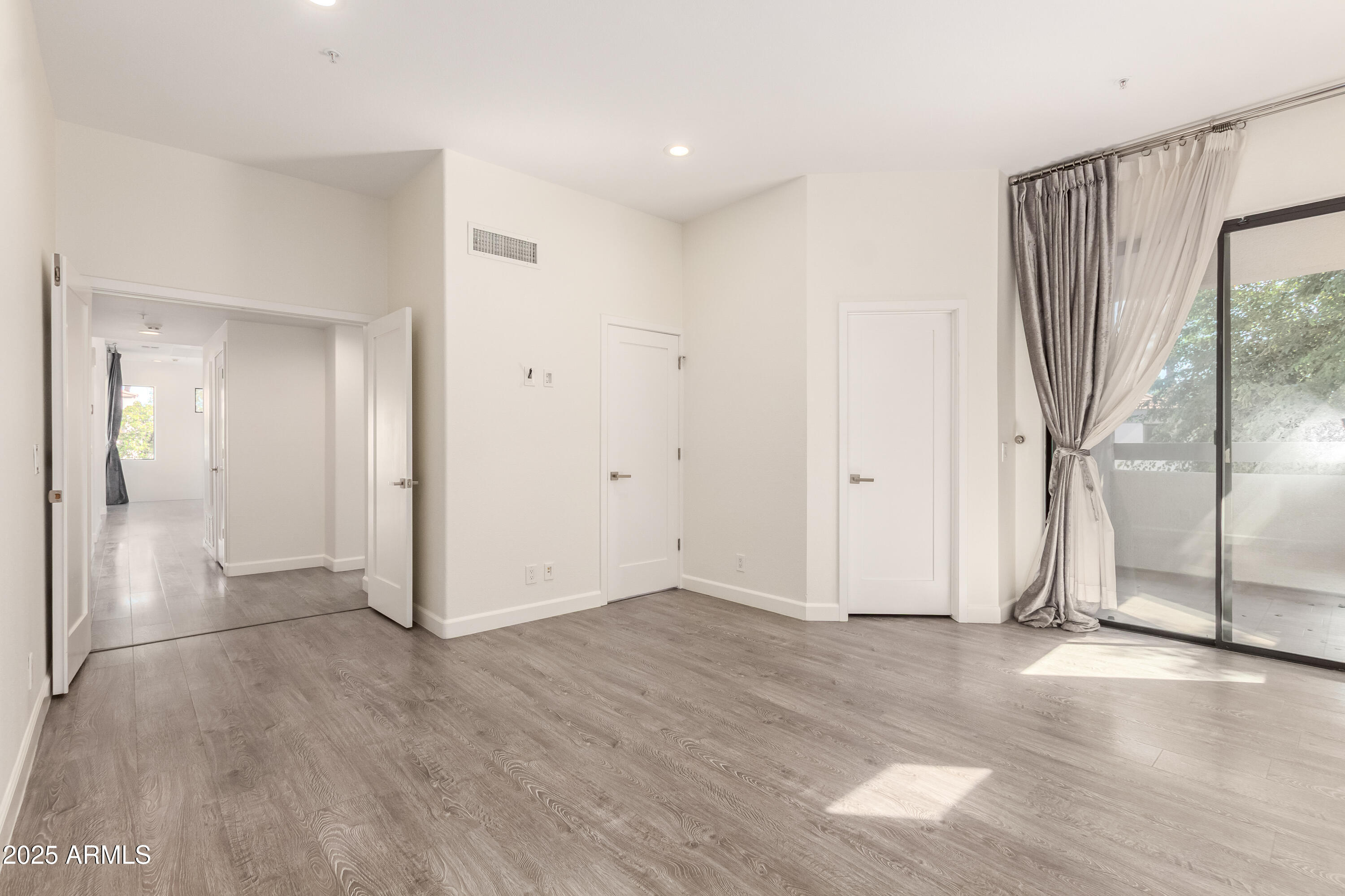 7222 East Gainey Ranch Road Scottsdale, AZ 85258 - Photo 7 of 13 a view of entryway with wooden floor