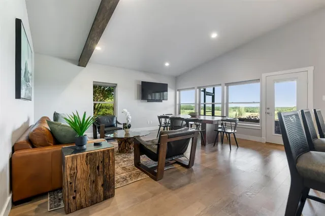 a spacious bathroom with a granite countertop double vanity sink and mirror