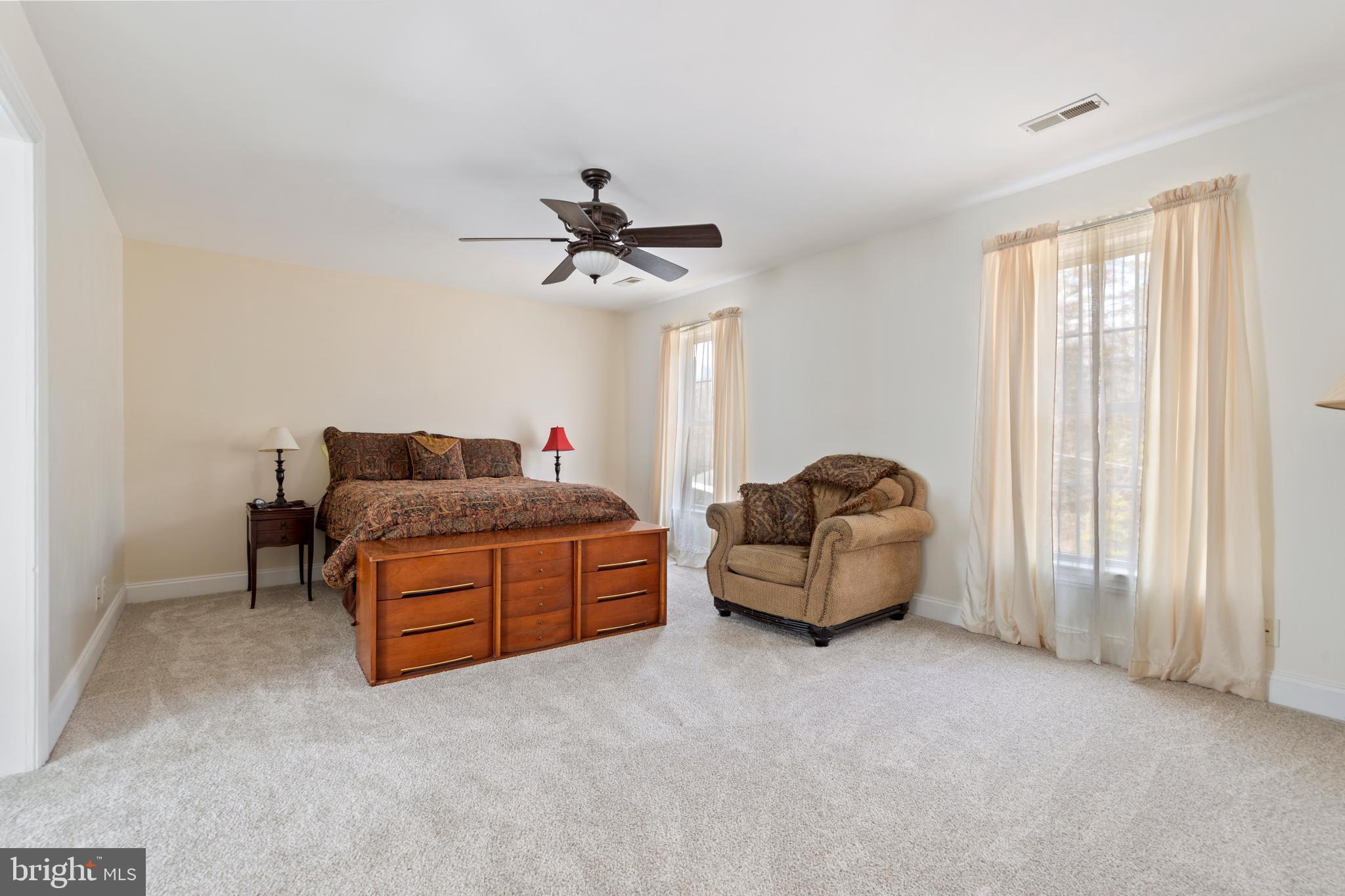 3336 Hunting Ridge Road Winchester, VA 22603 - Photo 18 of 50 a living room with furniture a ceiling fan and a window