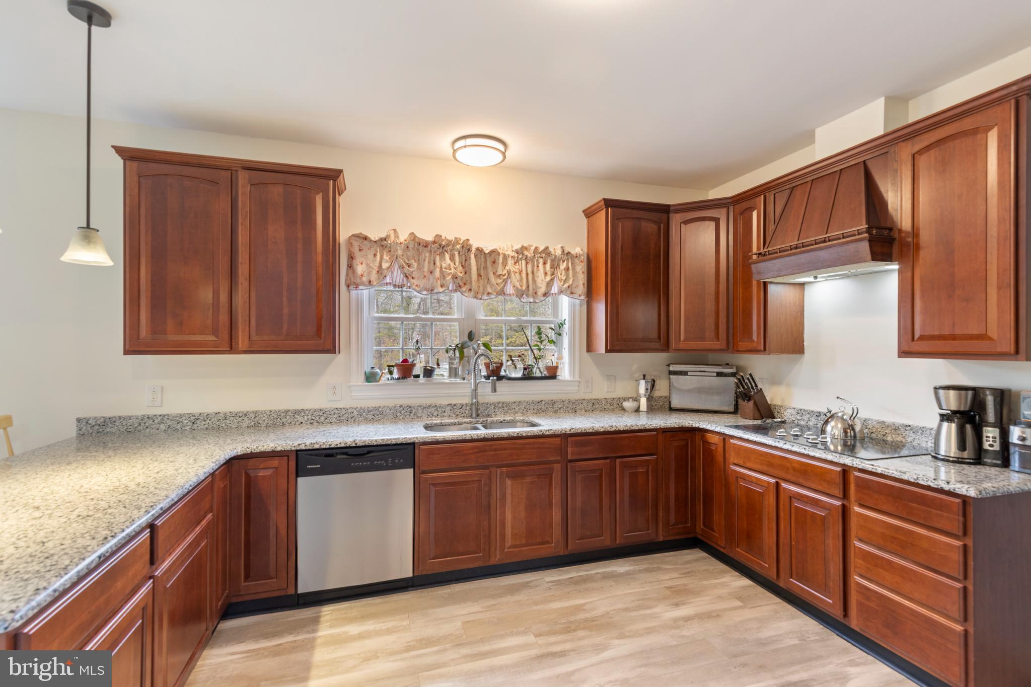 3336 Hunting Ridge Road Winchester, VA 22603 - Photo 8 of 50 a kitchen with lots of counter top space sink and cabinets
