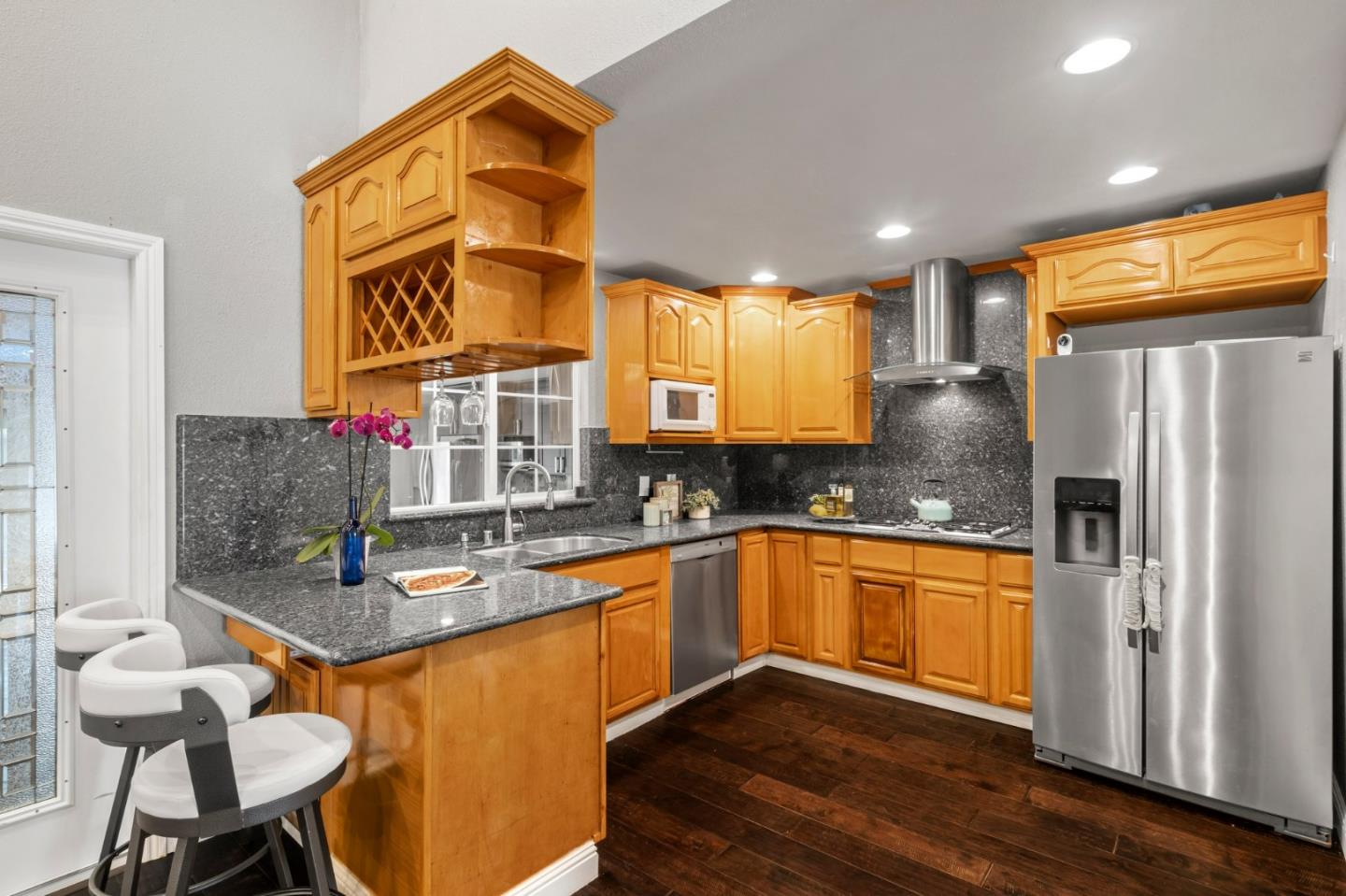 489 Hassinger Road San Jose, CA 95111 - Photo 14 of 41 a kitchen with stainless steel appliances granite countertop a sink refrigerator and cabinets
