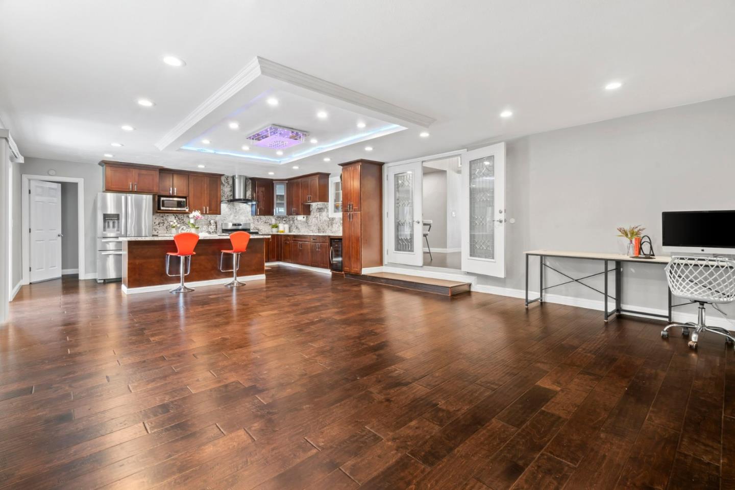 489 Hassinger Road San Jose, CA 95111 - Photo 17 of 41 a view of a living room and kitchen with furniture wooden floor and window