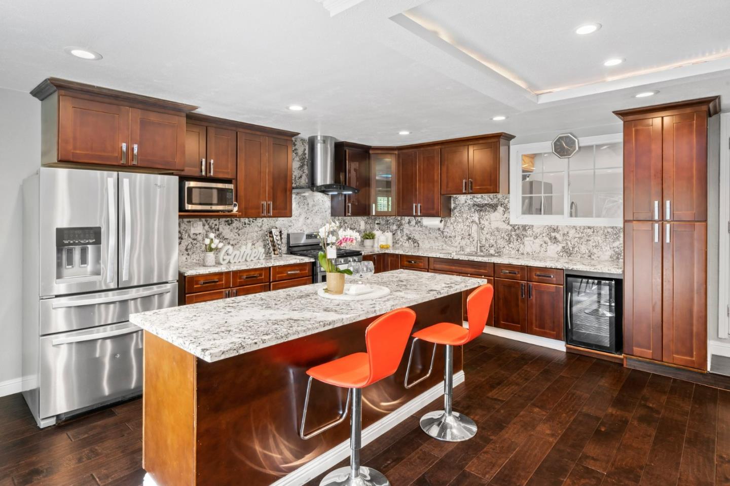 489 Hassinger Road San Jose, CA 95111 - Photo 18 of 41 a kitchen with stainless steel appliances granite countertop a kitchen island a stove a refrigerator and a cabinets
