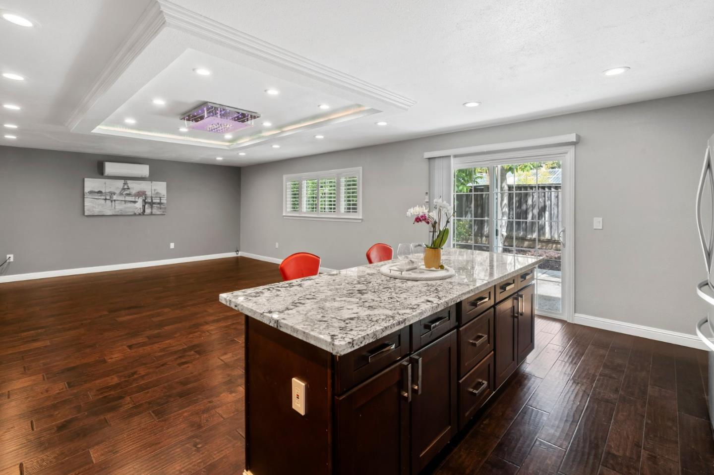 489 Hassinger Road San Jose, CA 95111 - Photo 20 of 41 a view of kitchen island with granite countertop furniture and wooden floor