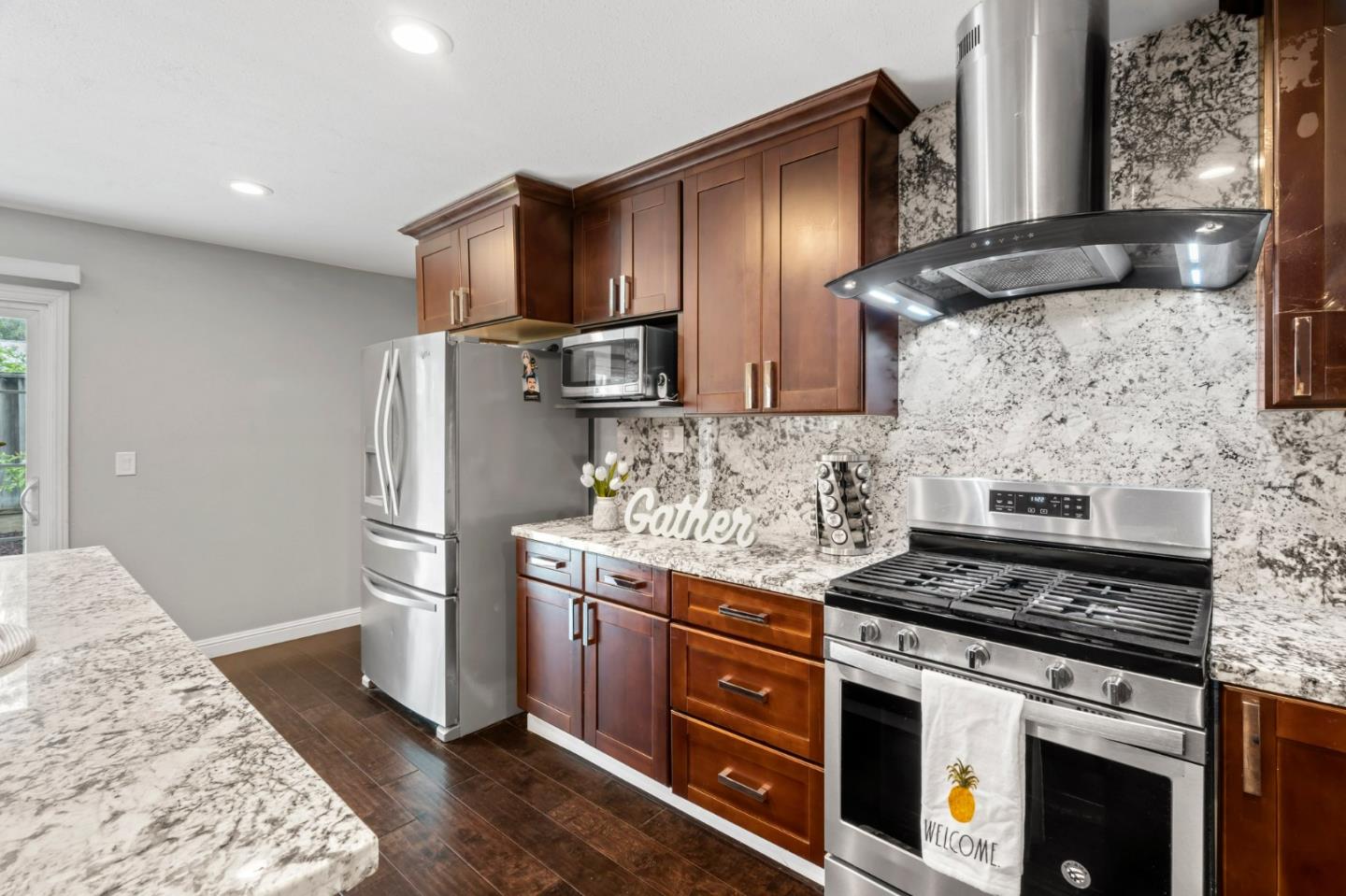 489 Hassinger Road San Jose, CA 95111 - Photo 21 of 41 a kitchen with stainless steel appliances granite countertop a stove a refrigerator and a wooden cabinets