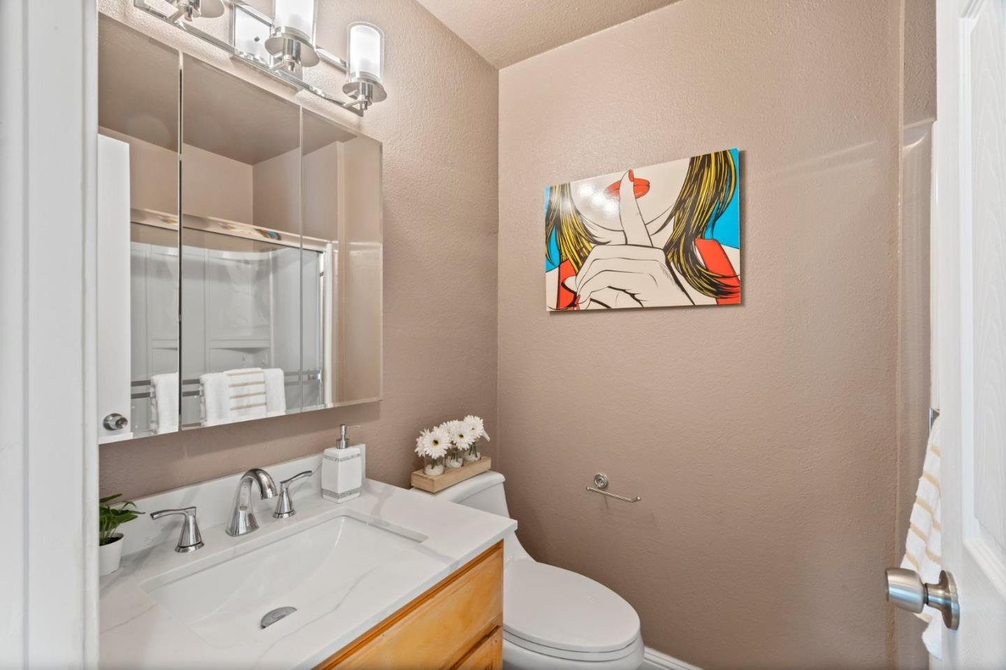 489 Hassinger Road San Jose, CA 95111 - Photo 30 of 41 a bathroom with a sink mirror vanity and toilet