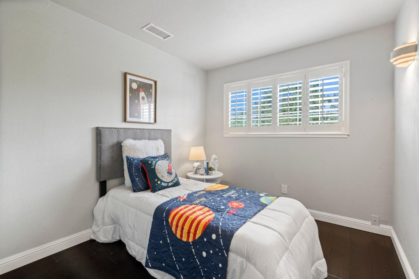 489 Hassinger Road San Jose, CA 95111 - Photo 33 of 41 a bedroom with a bed and wooden floor