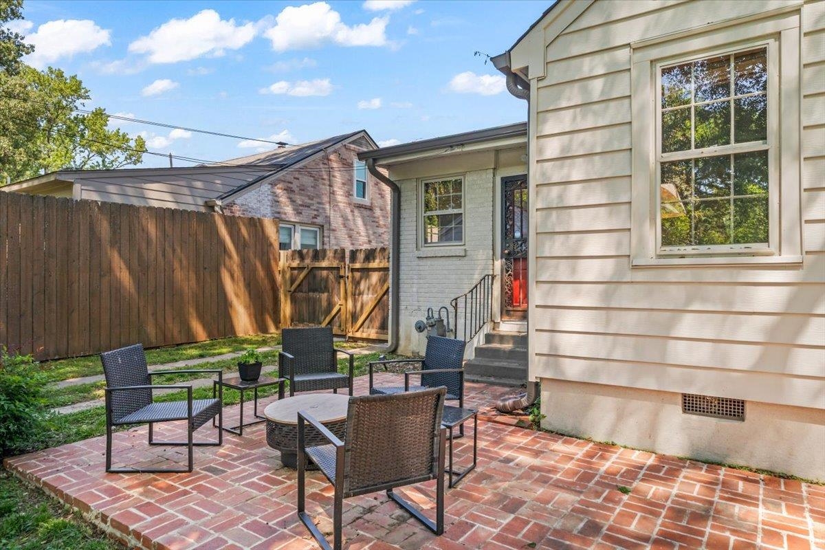 381 Ellsworth Street Memphis, TN 38111 - Photo 29 of 32 a backyard of a house with barbeque oven table and chairs