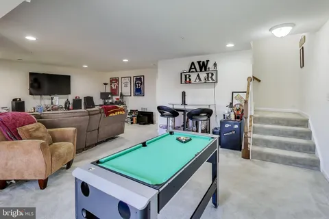 a living room with furniture and a pool