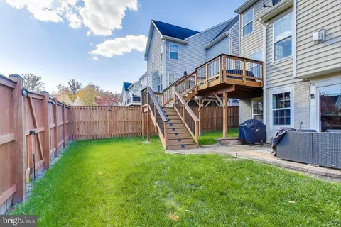 a view of an house with a backyard