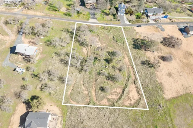 an aerial view of residential house and outdoor space