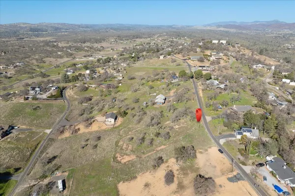 a view of a covered with trees in the background