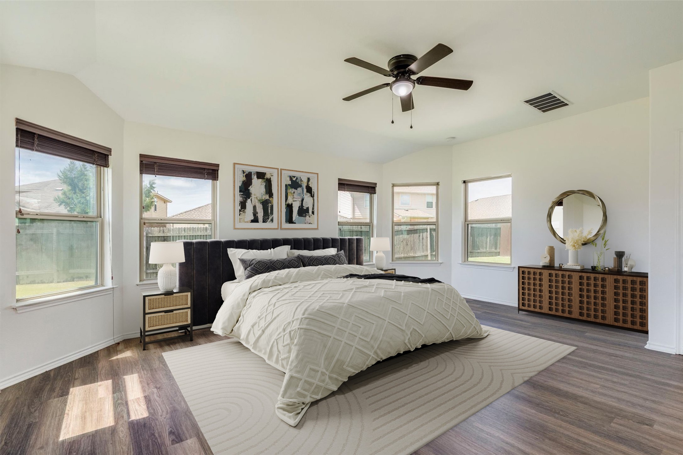 16829 Ruggio Road Pflugerville, TX 78660 - Photo 19 of 40 a bedroom with a large bed and windows