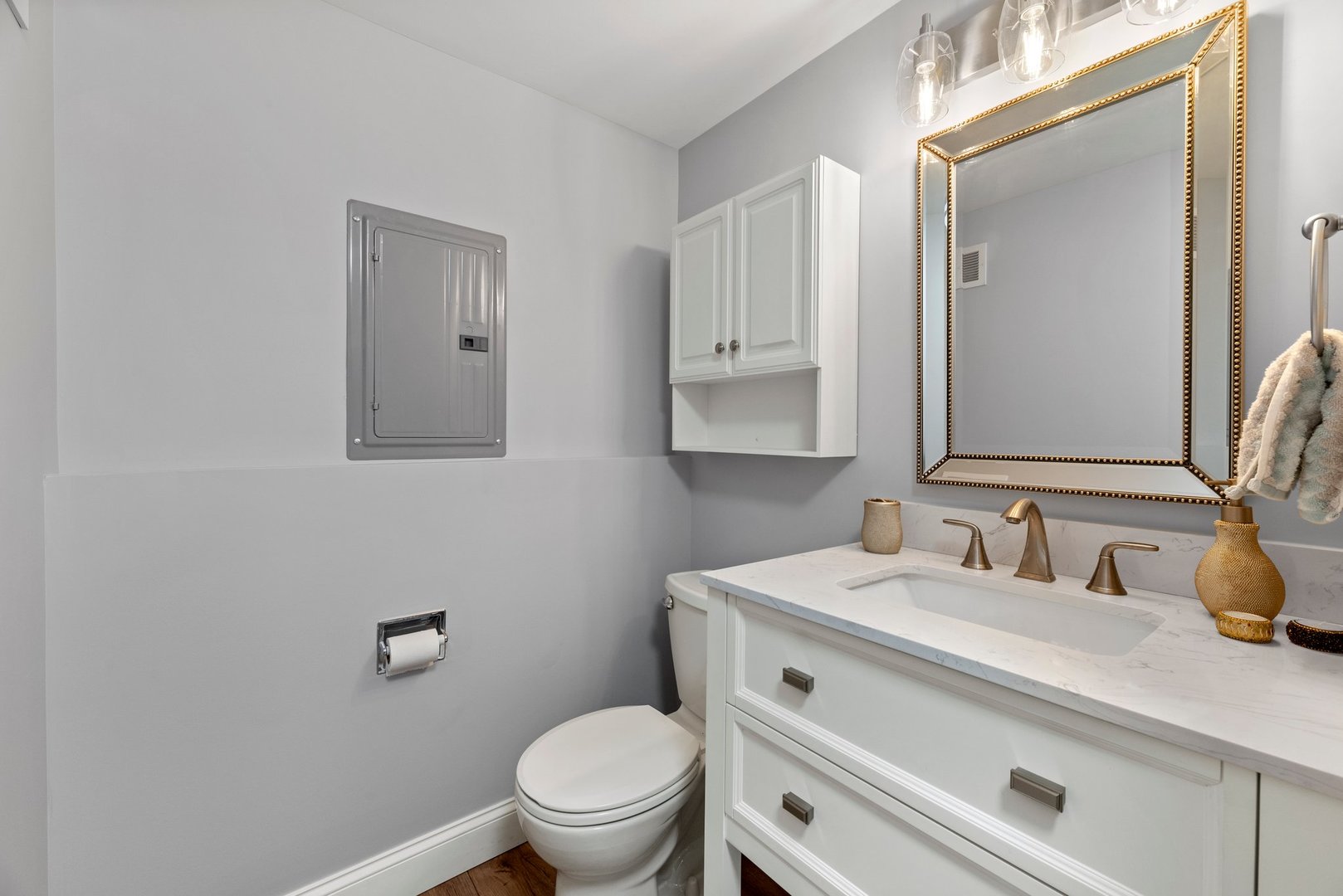 1641 Timber Trail, Unit A Wheaton, IL 60189 - Photo 14 of 16 a bathroom with a toilet sink vanity and mirror