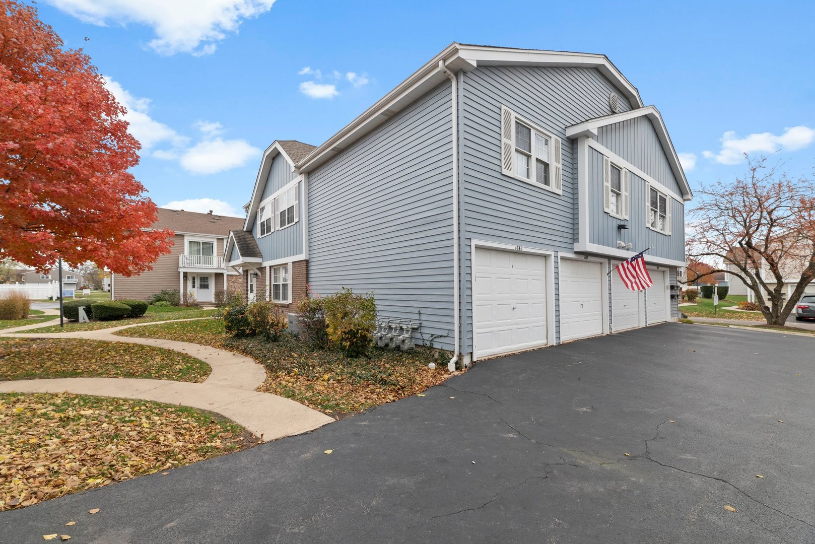 1641 Timber Trail, Unit A Wheaton, IL 60189 - Photo 16 of 16 a view of a house with a yard