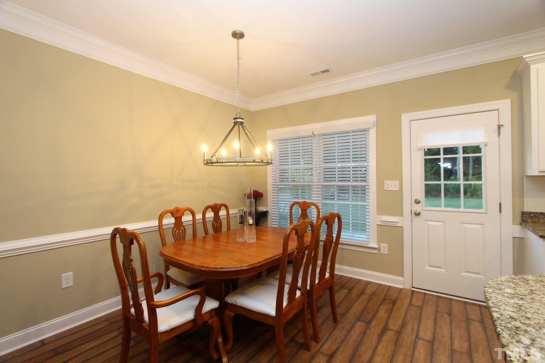5436 Shepherd Road Wilson, NC 27893 - Photo 14 of 28 a view of a dining room with furniture window and wooden floor
