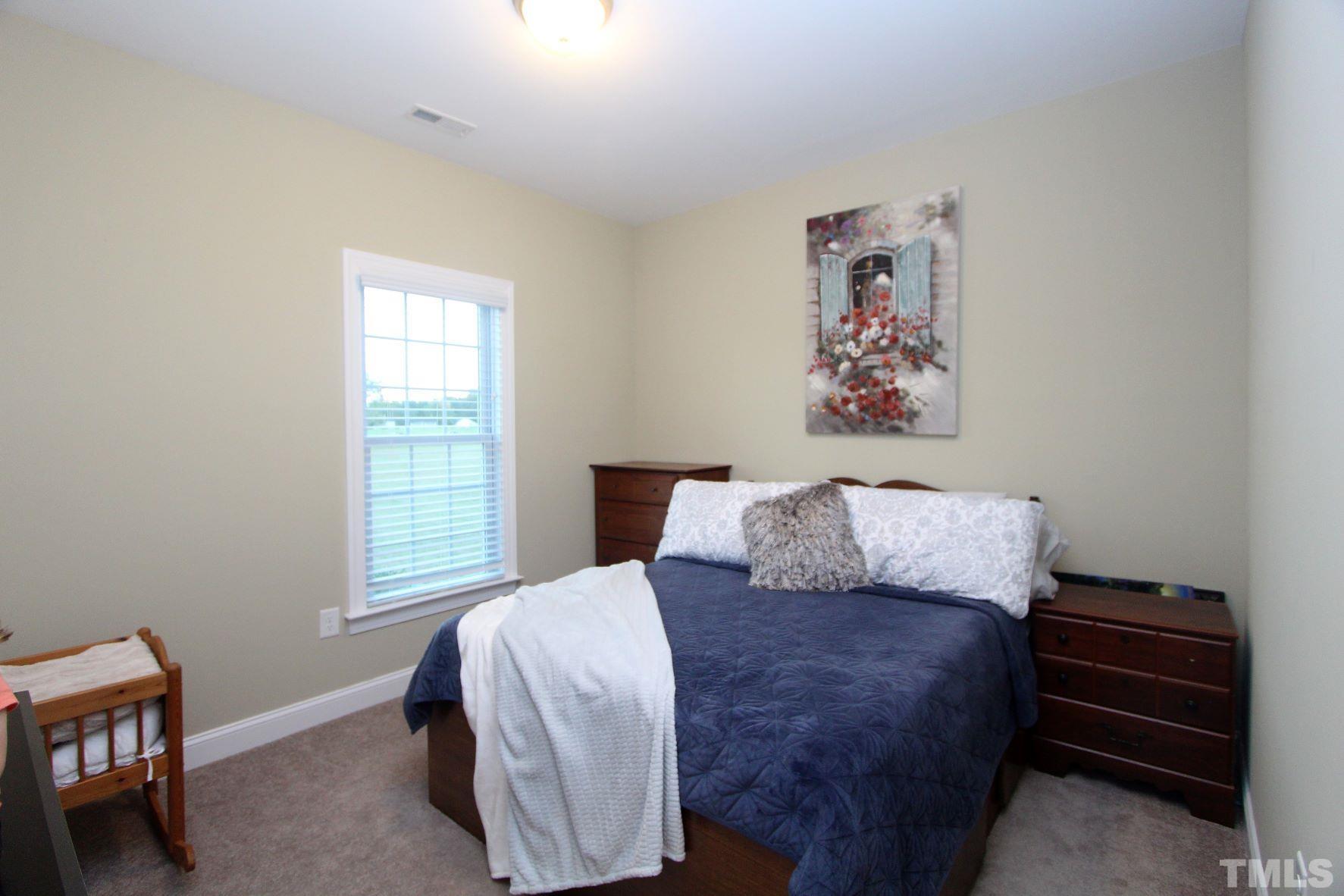 5436 Shepherd Road Wilson, NC 27893 - Photo 23 of 28 a bedroom with a bed and a window