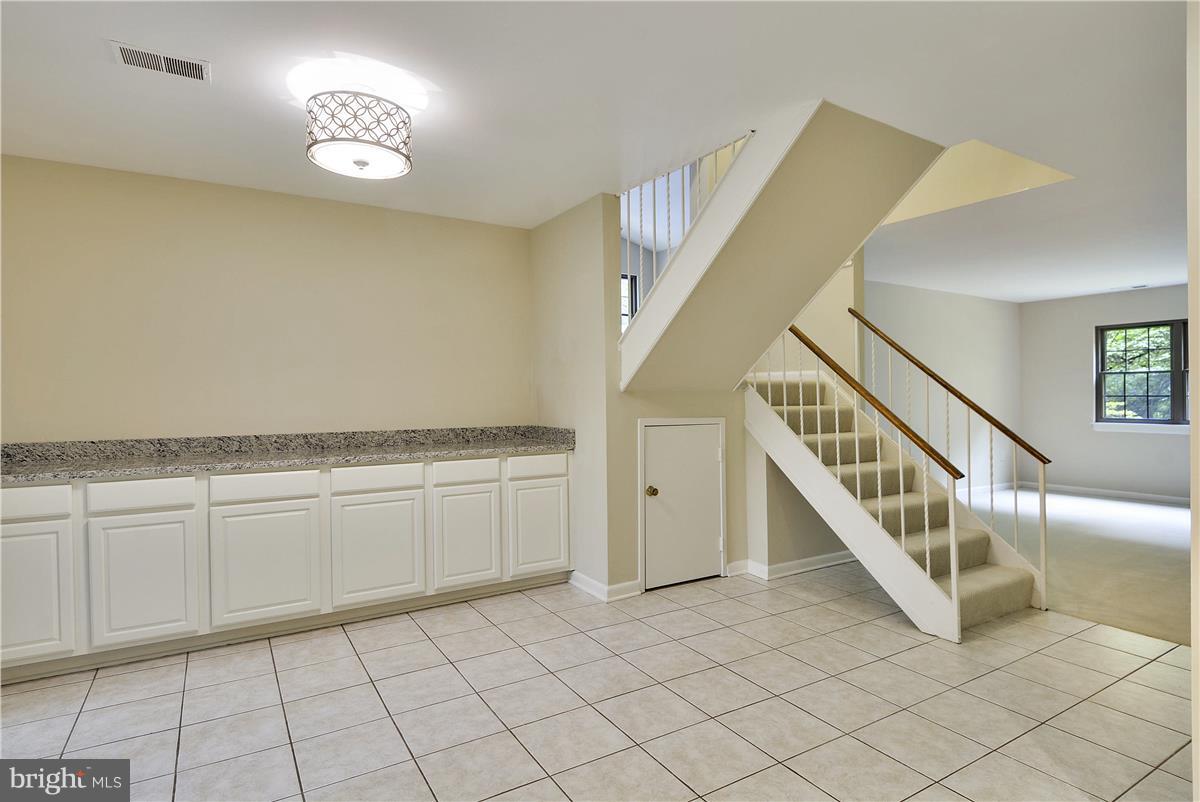 2000 Headlands Circle Reston, VA 20191 - Photo 12 of 23 a view of a livingroom with an entryway and stairs
