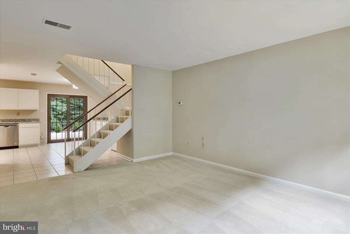 2000 Headlands Circle Reston, VA 20191 - Photo 13 of 23 a view of an empty room with stairs