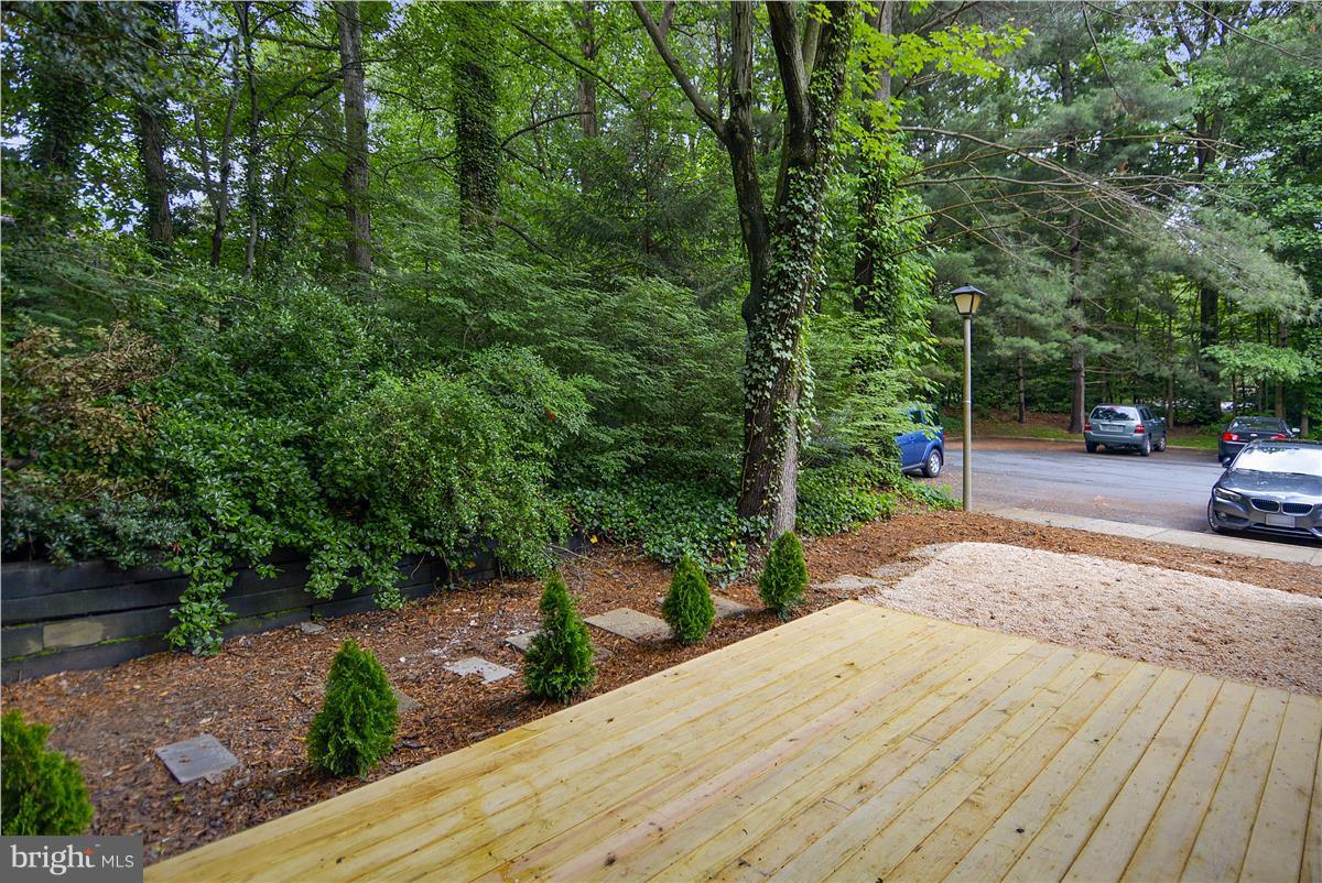 2000 Headlands Circle Reston, VA 20191 - Photo 4 of 23 a view of a street with a bench and trees