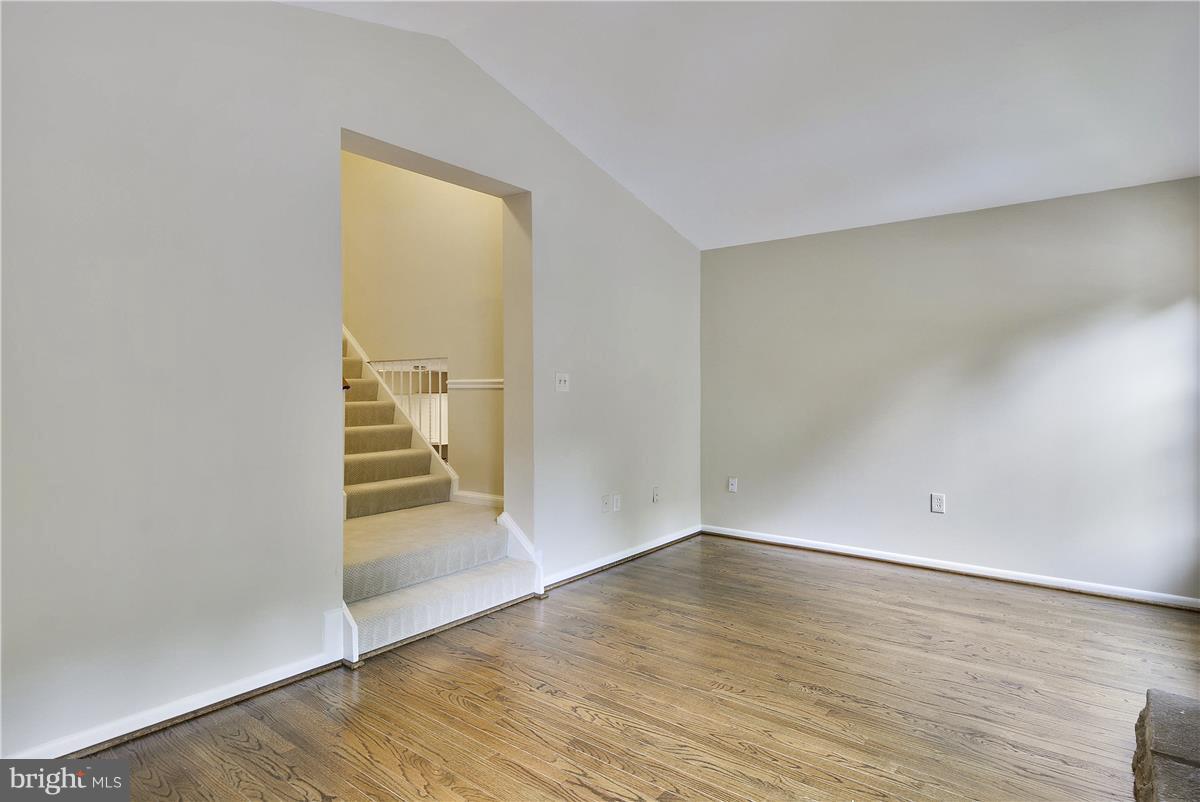 2000 Headlands Circle Reston, VA 20191 - Photo 7 of 23 an empty room with wooden floor and windows