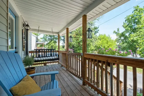 a view of a two chairs in the balcony