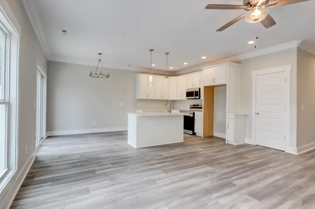a view of kitchen with wooden floor and window