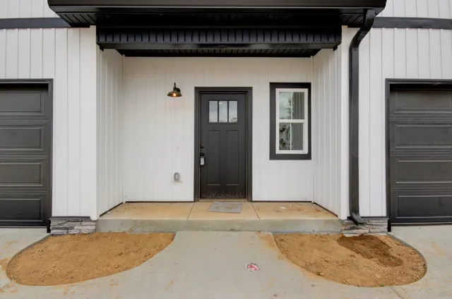 a view of a house with a wooden deck