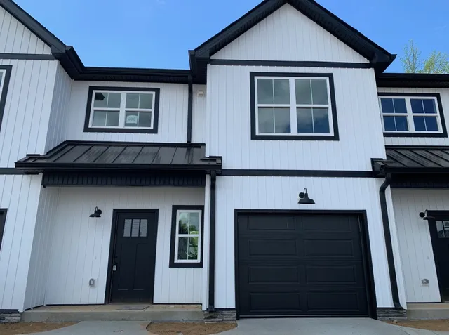 a front view of a house with glass windows