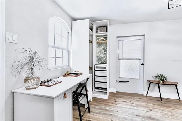 a view of a dining room with furniture and window