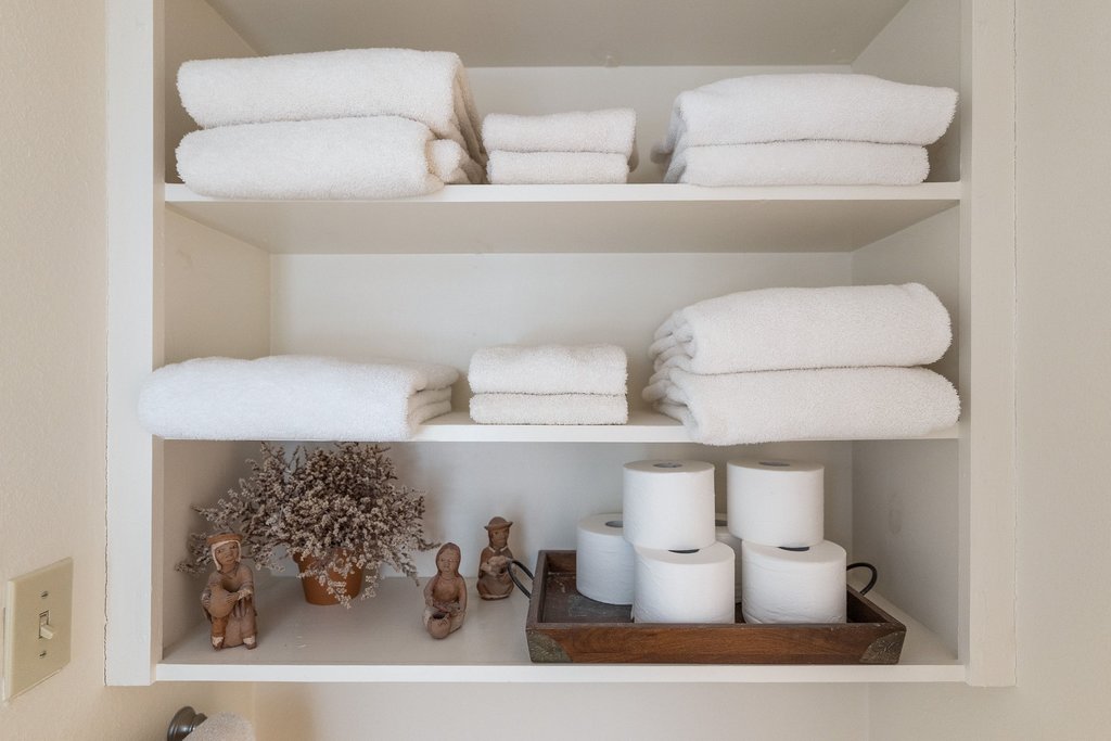 3500 Enfield Road, Unit E Austin, TX 78703 - Photo 32 of 40 The open shelving in the bathroom is the perfect space for added storage with a stylish flair.