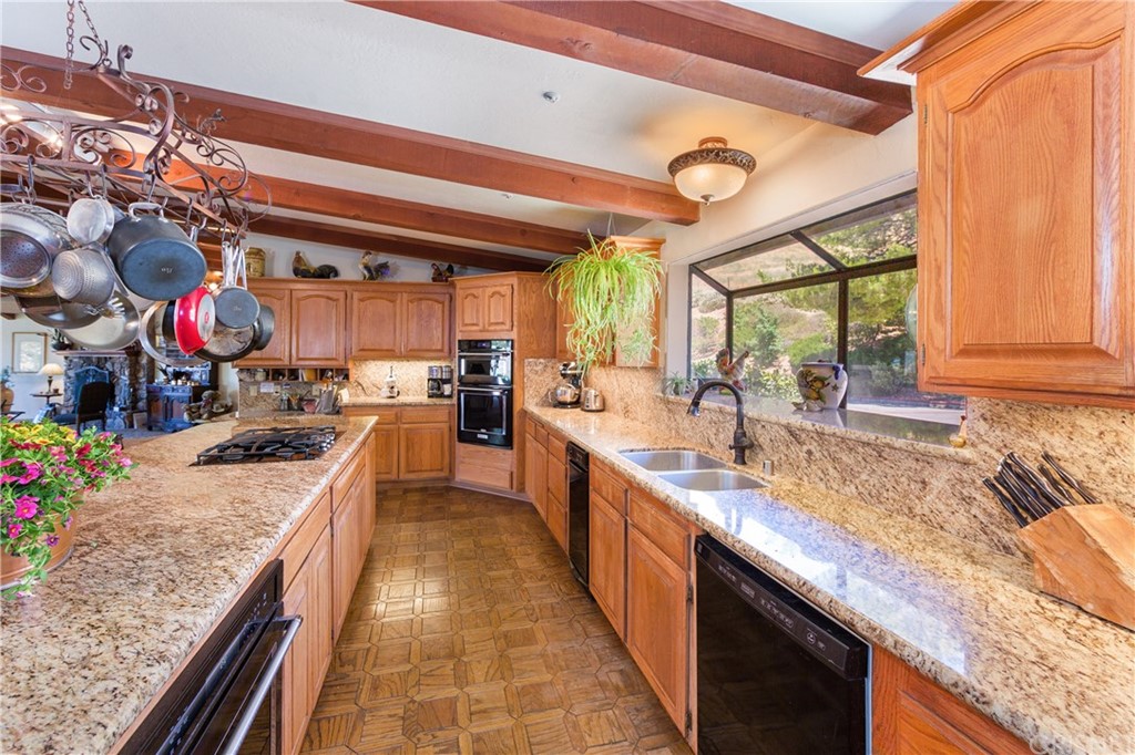 38833 Gorman Post Road Lebec, CA 93243 - Photo 13 of 55 a large kitchen with stainless steel appliances granite countertop a sink and counter space