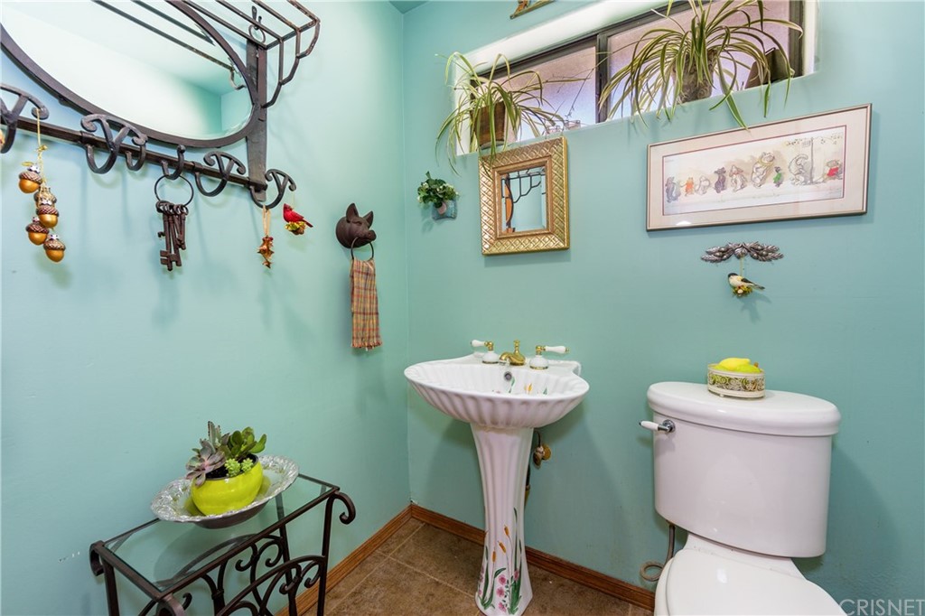 38833 Gorman Post Road Lebec, CA 93243 - Photo 22 of 55 a bathroom with a toilet sink and mirror