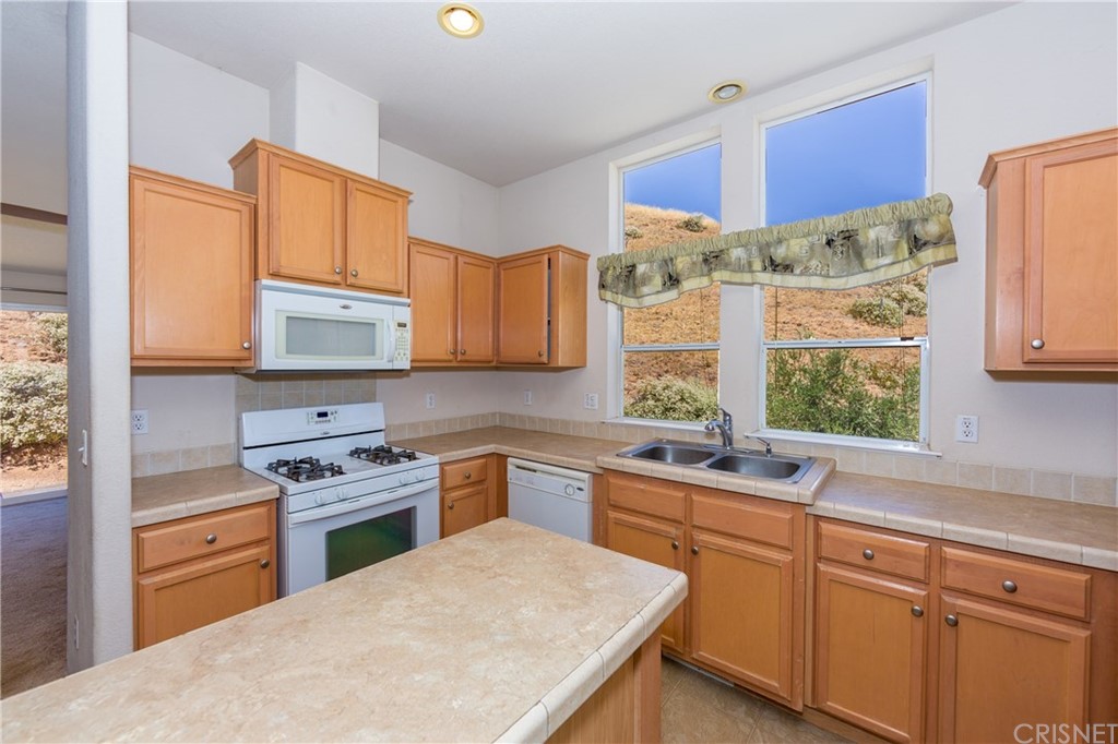 38833 Gorman Post Road Lebec, CA 93243 - Photo 35 of 55 a kitchen with stainless steel appliances a sink stove and window