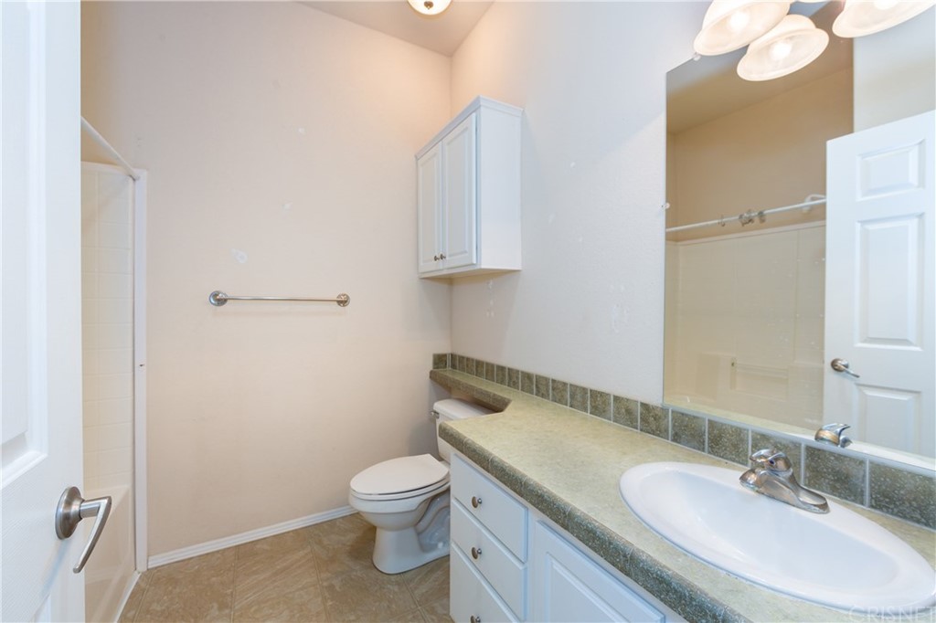 38833 Gorman Post Road Lebec, CA 93243 - Photo 41 of 55 a bathroom with a granite countertop toilet sink and mirror