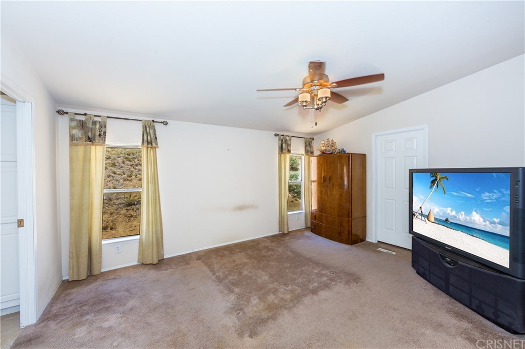 38833 Gorman Post Road Lebec, CA 93243 - Photo 42 of 55 a view of livingroom with hardwood floor and a ceiling fan