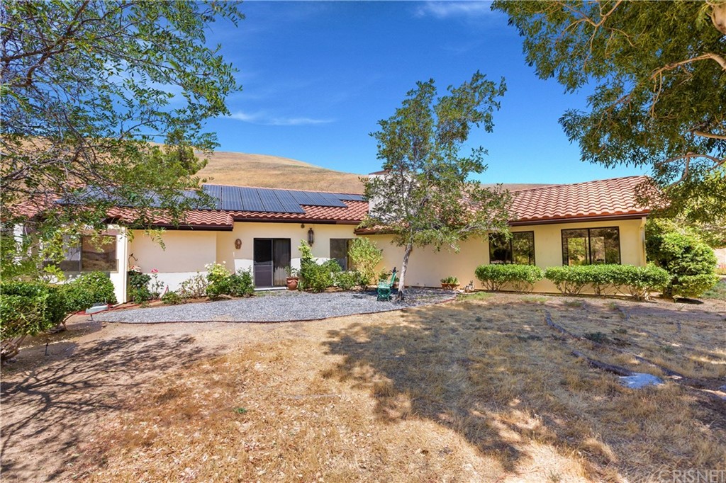 38833 Gorman Post Road Lebec, CA 93243 - Photo 6 of 55 a front view of a house with a yard and garage