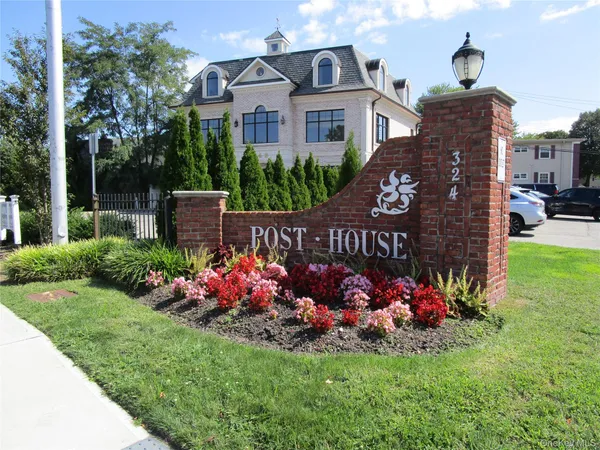 a view of a house front with a garden