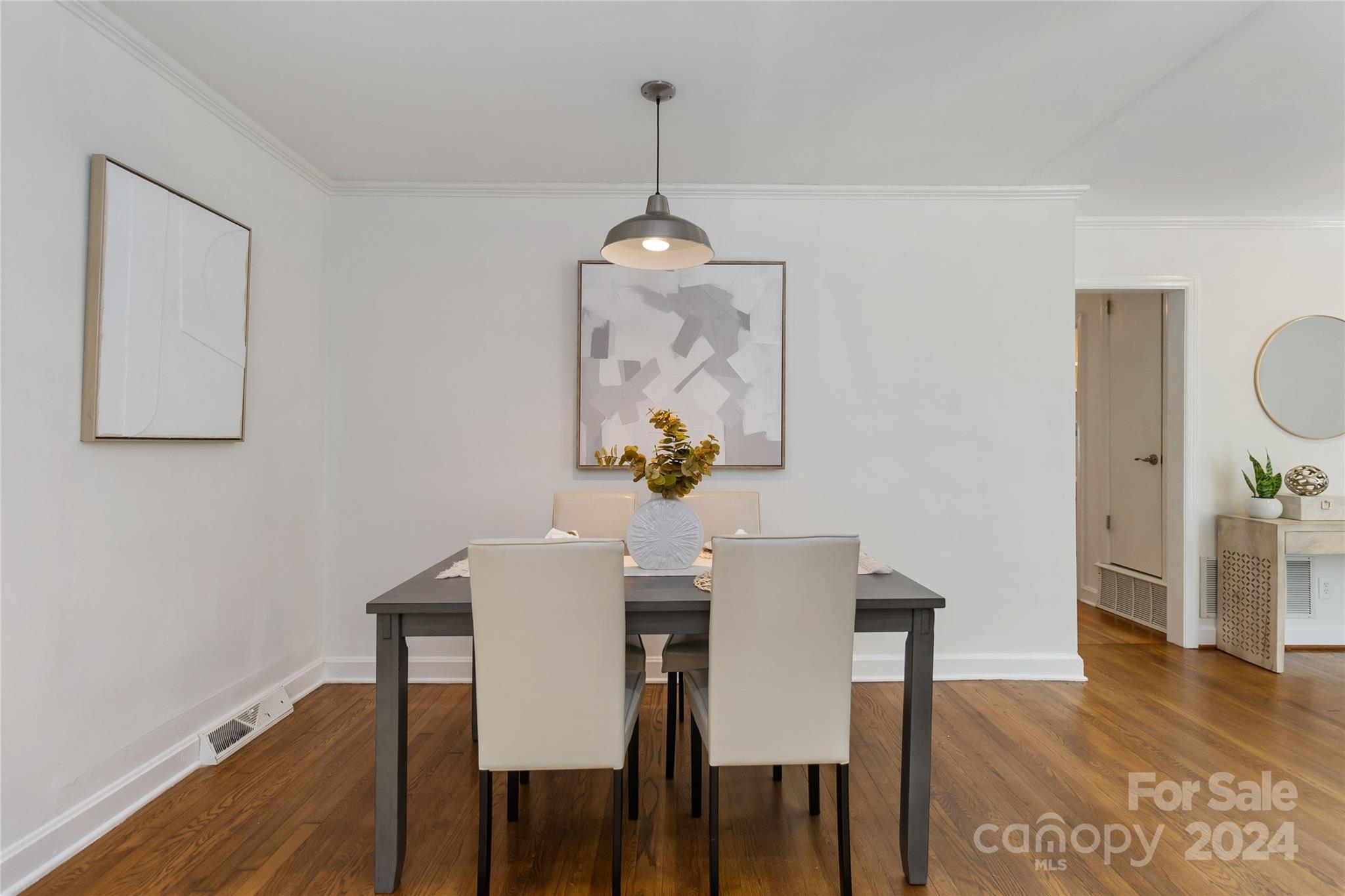 4346 Applegate Road Charlotte, NC 28209 - Photo 13 of 35 a view of a dining room with furniture wooden floor and chandelier