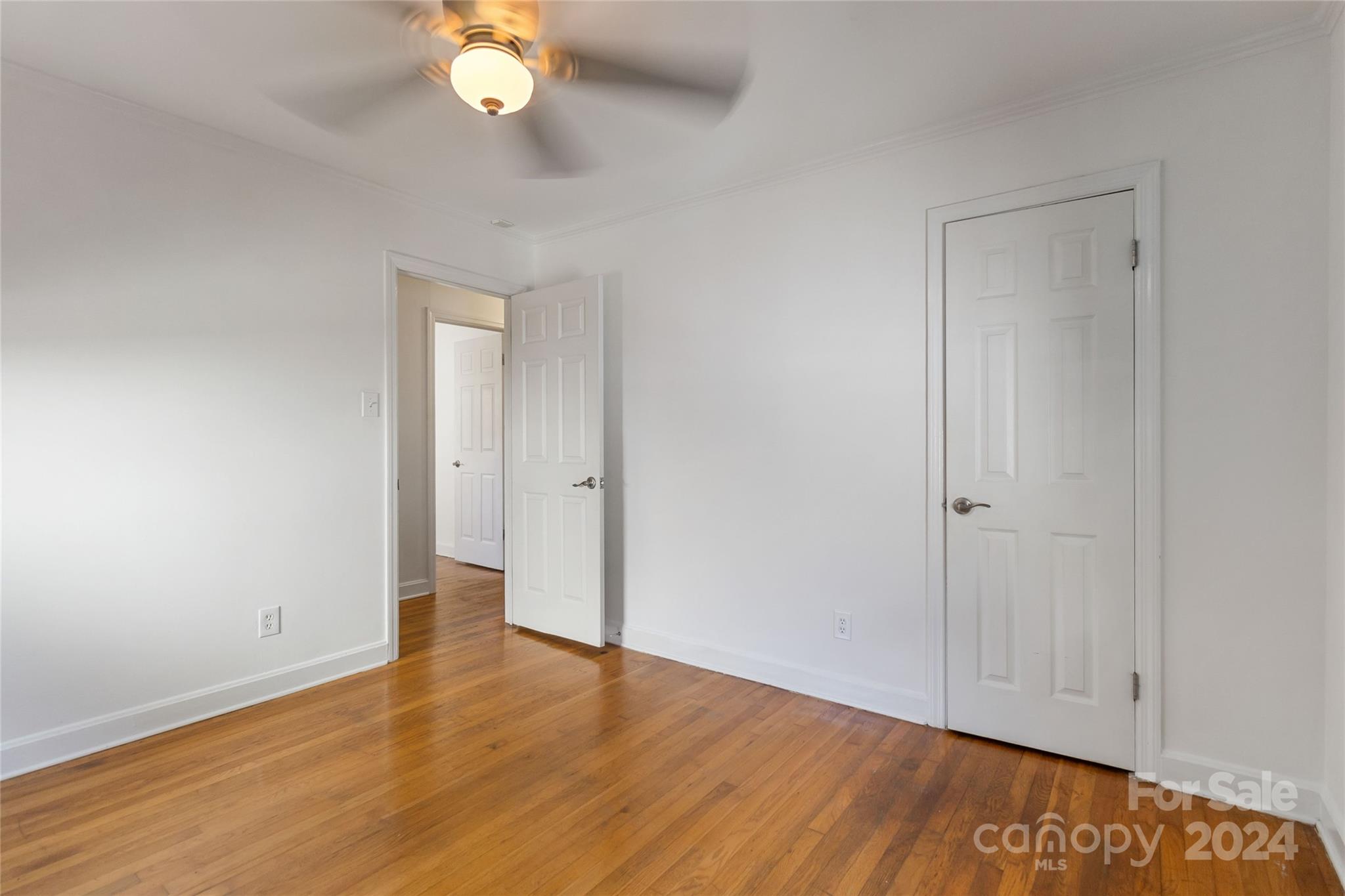 4346 Applegate Road Charlotte, NC 28209 - Photo 22 of 35 a view of an empty room with wooden floor and a window