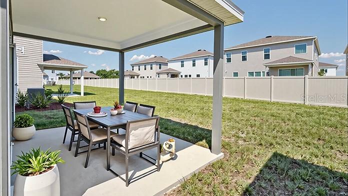 4280 Southwest 52nd Lane Road Ocala, FL 34474 - Photo 13 of 25 a view of a patio with table and chairs potted plants with floor to ceiling window and potted plants
