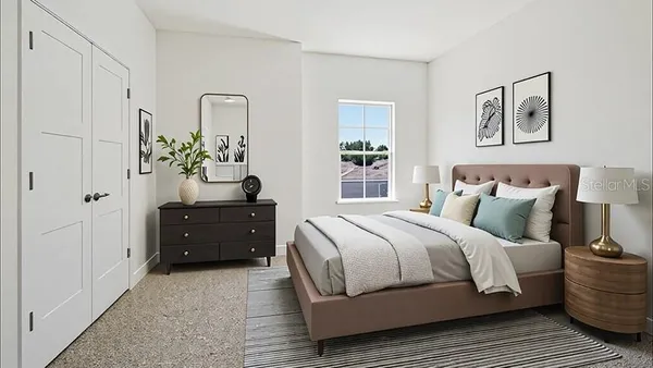 a bedroom with a bed and a dresser