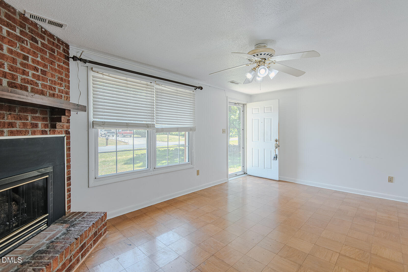 1302 Blacksmith Road Efland, NC 27243 - Photo 12 of 46 a view of an empty room with a fireplace and a window