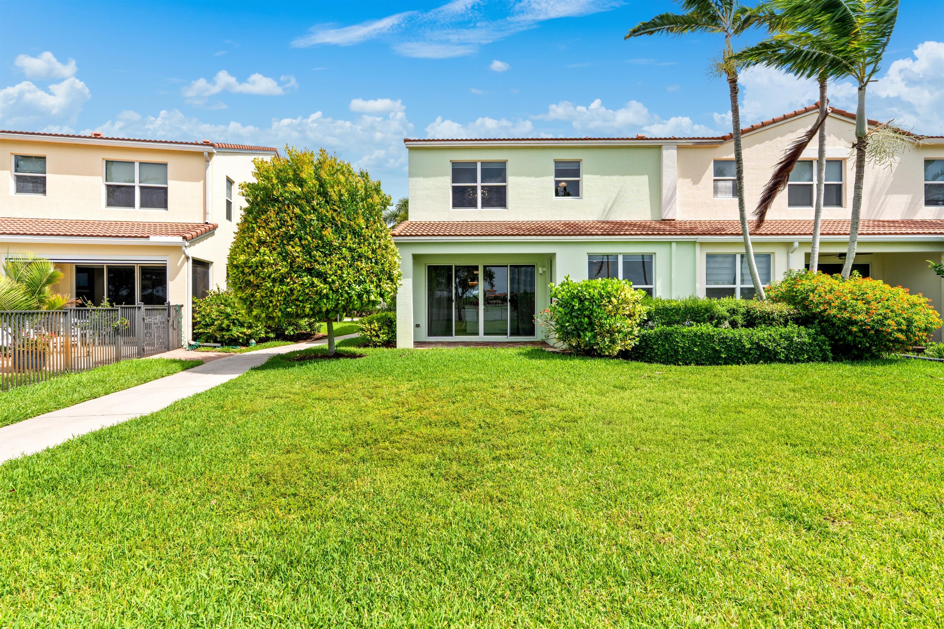 1570 Northwest 48th Place Boca Raton, FL 33431 - Photo 28 of 30 front view of a house with a yard