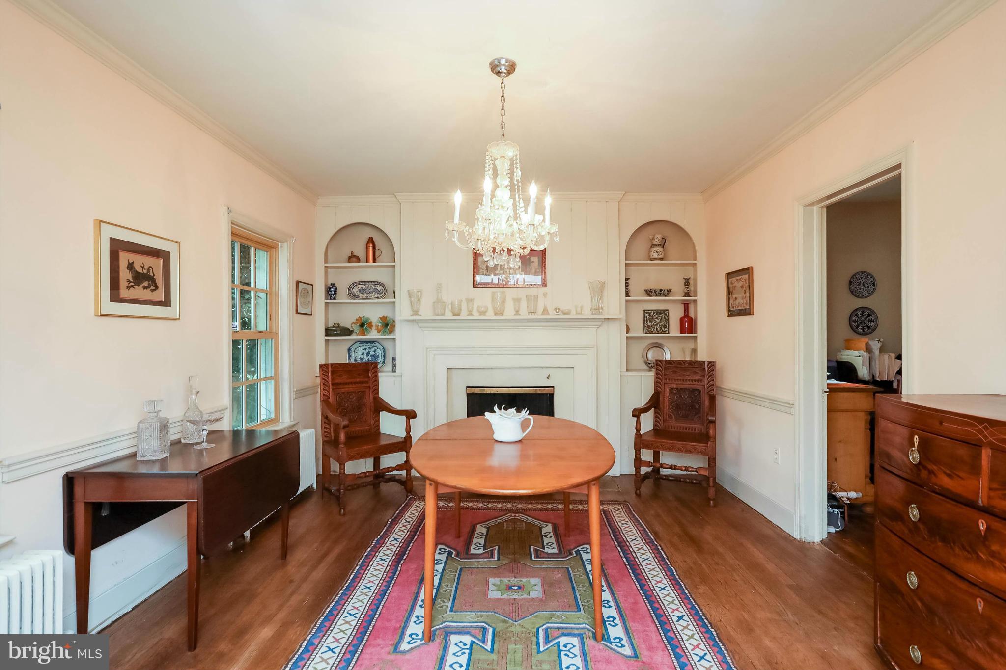 2801 Ridge Rd Drive Alexandria, VA 22302 - Photo 4 of 25 a living room with furniture a rug and a chandelier