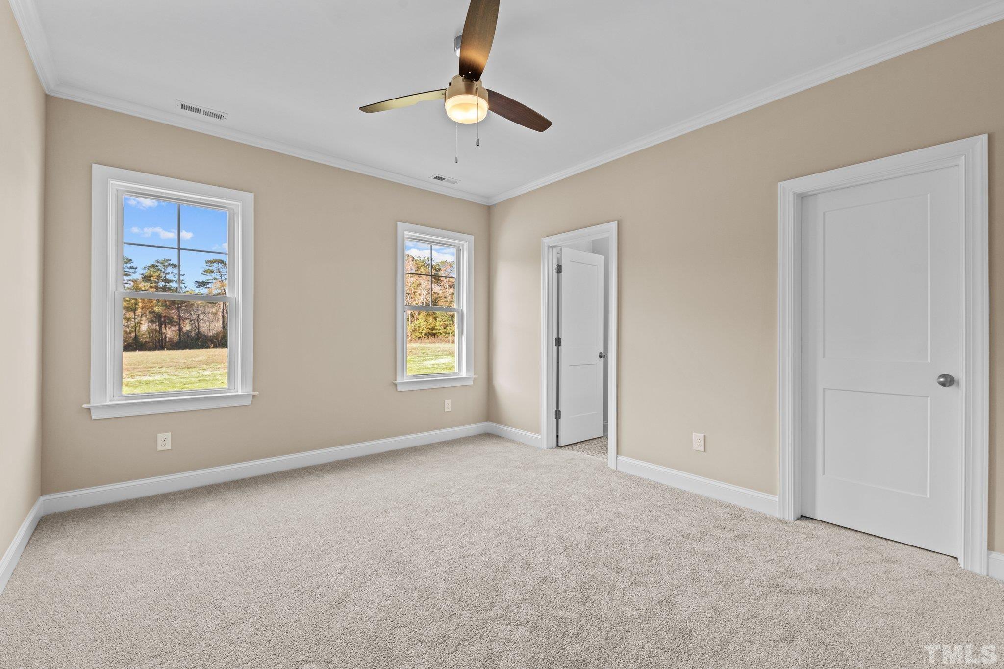 454 Pine Ridge Road Zebulon, NC 27597 - Photo 12 of 42 a view of an empty room with a window