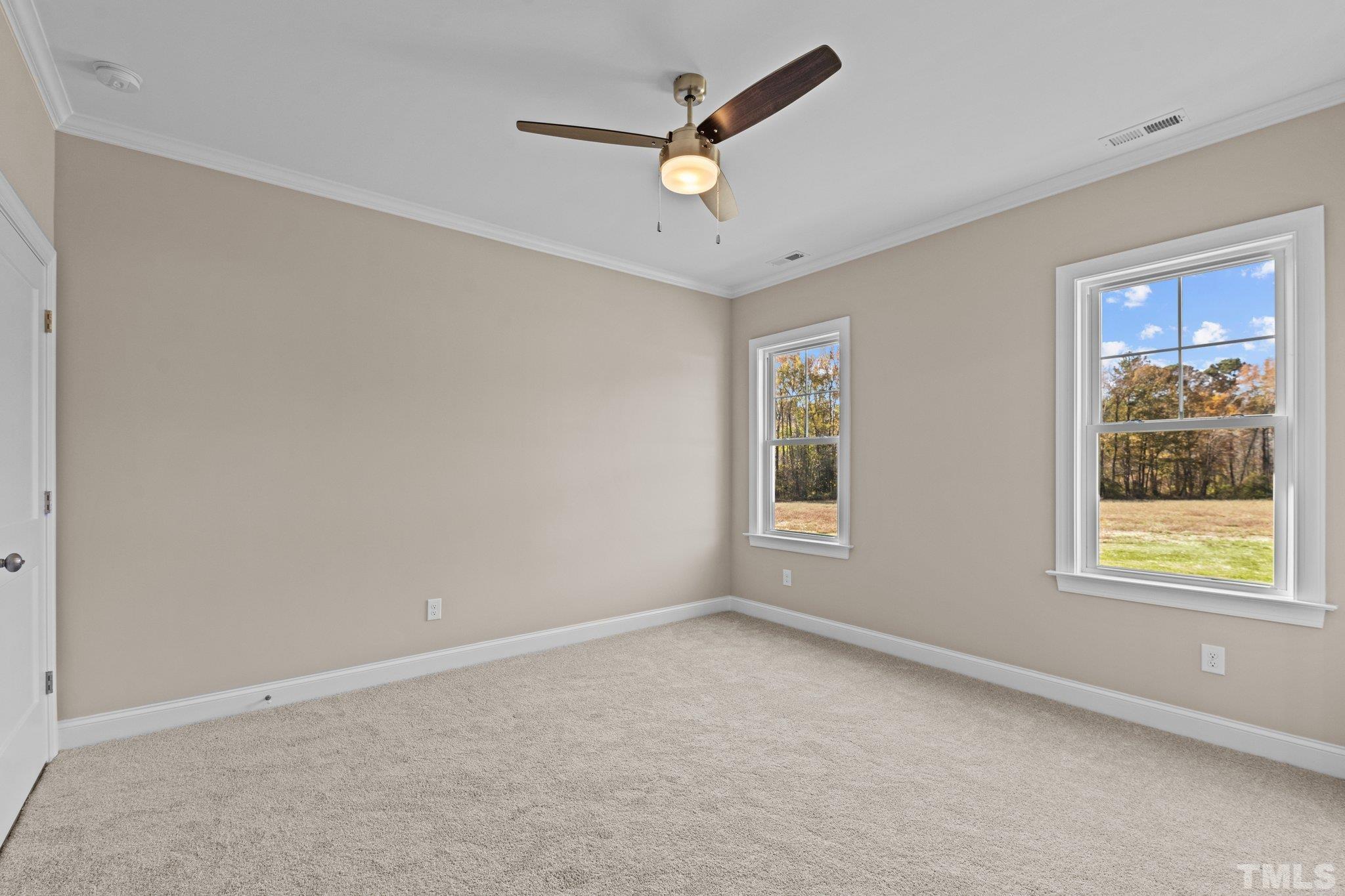 454 Pine Ridge Road Zebulon, NC 27597 - Photo 13 of 42 a view of an empty room with a window
