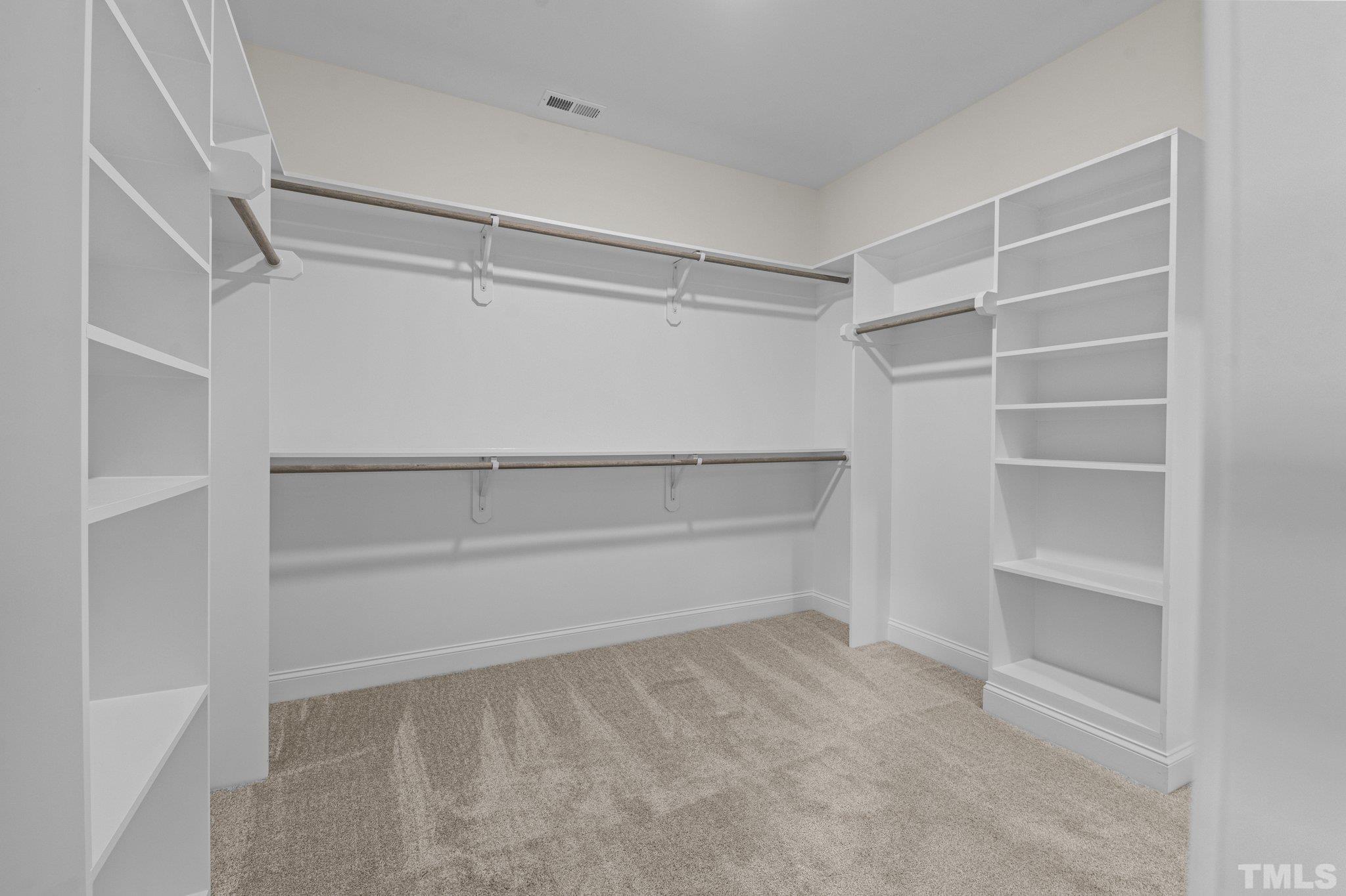 454 Pine Ridge Road Zebulon, NC 27597 - Photo 18 of 42 a view of an empty walk in closet